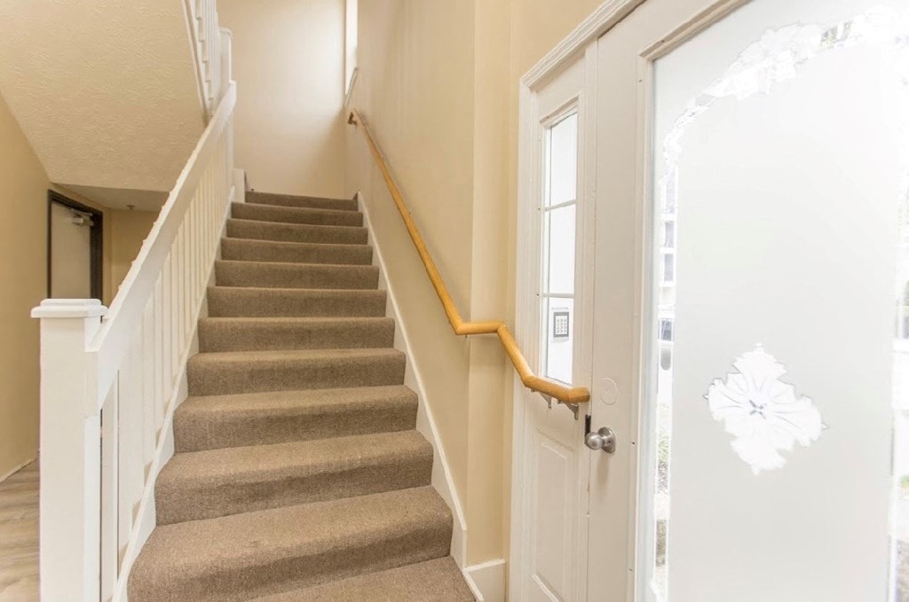 the stairway up to the second floor of a house