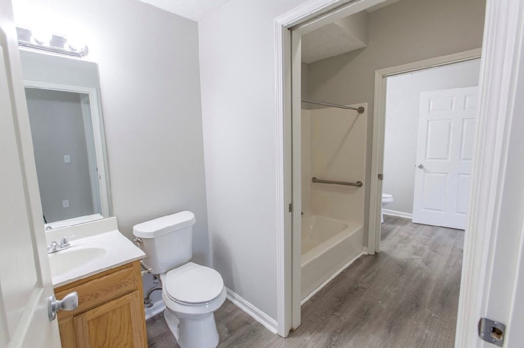 a bathroom with a sink toilet and a shower