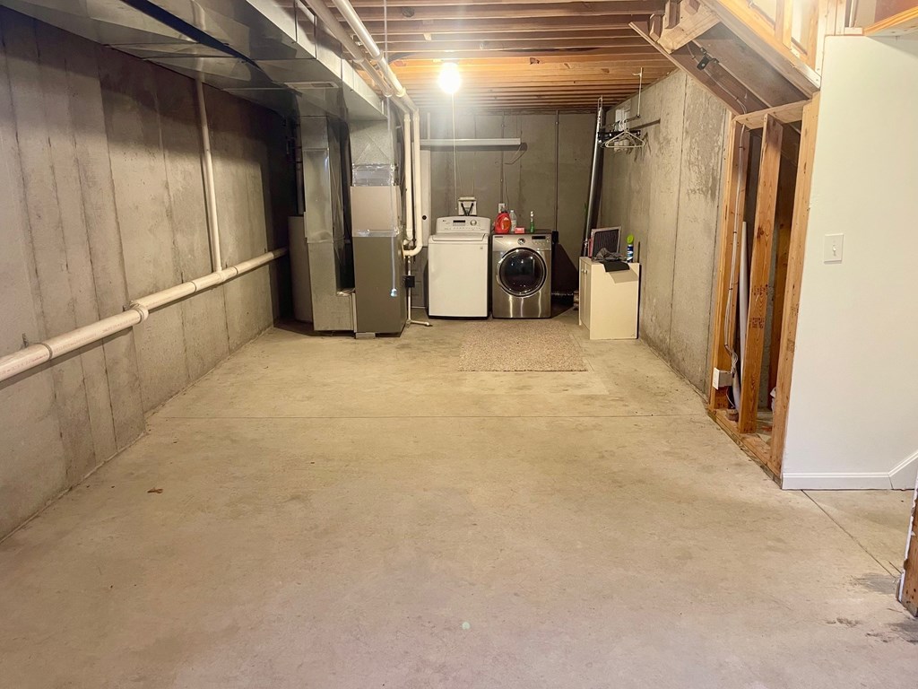 A basement with a washer and dryer.