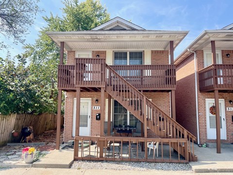 A house with a white door and a number 511 on it.