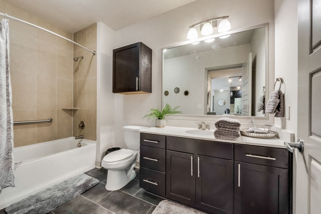 a bathroom with a sink toilet and a bath tub