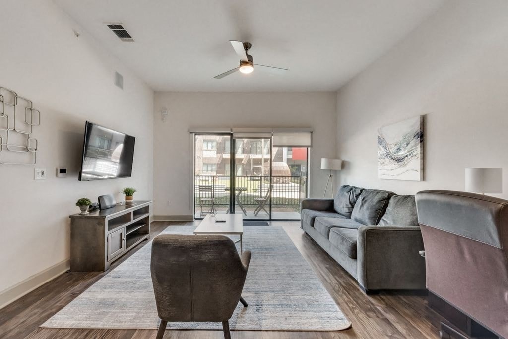 a living room with a couch and a tv