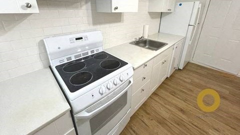 a kitchen with a stove and a sink