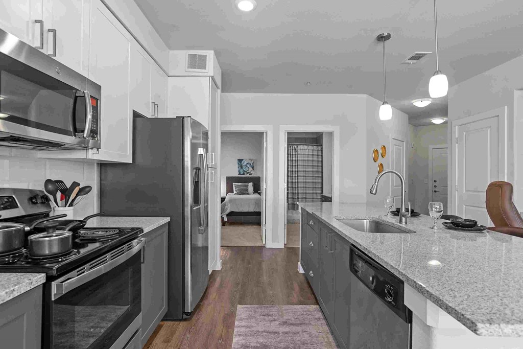 a kitchen with stainless steel appliances and a counter top