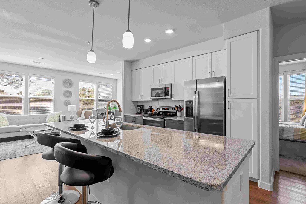 a kitchen with a counter top and a sink