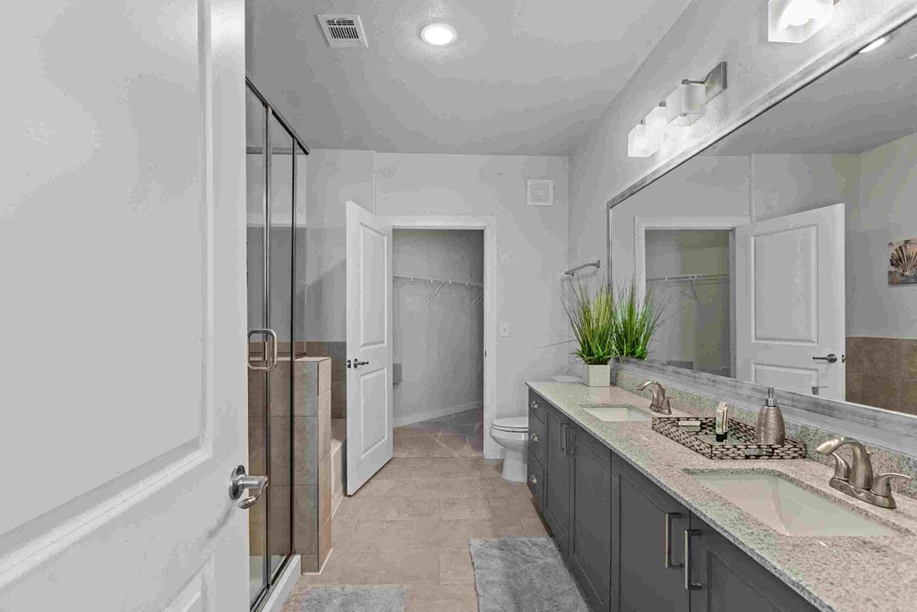 a bathroom with a sink and a shower in it