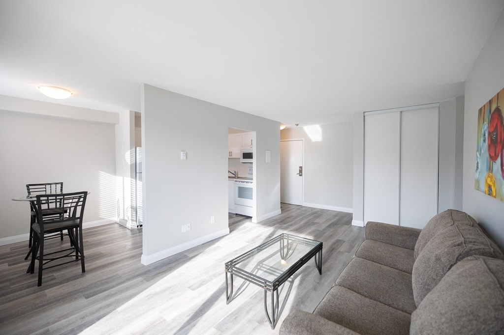 a living room with a couch and a glass coffee table