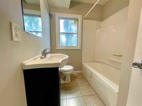 a bathroom with a sink toilet and a bath tub