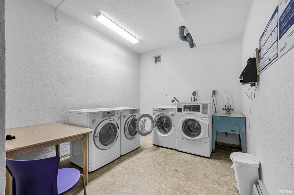 A laundry room with a washer and dryer.