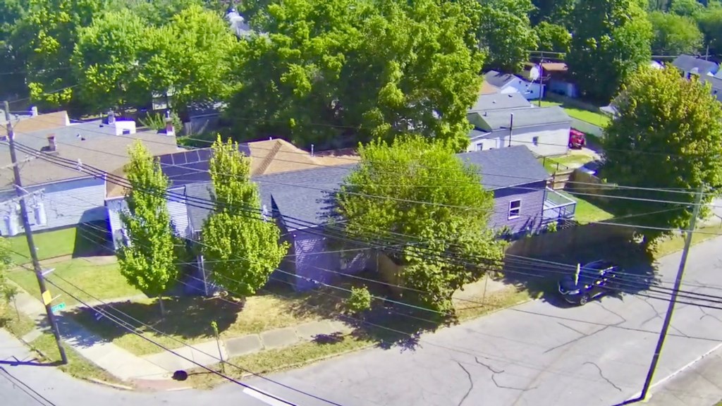 A residential area with houses and trees.