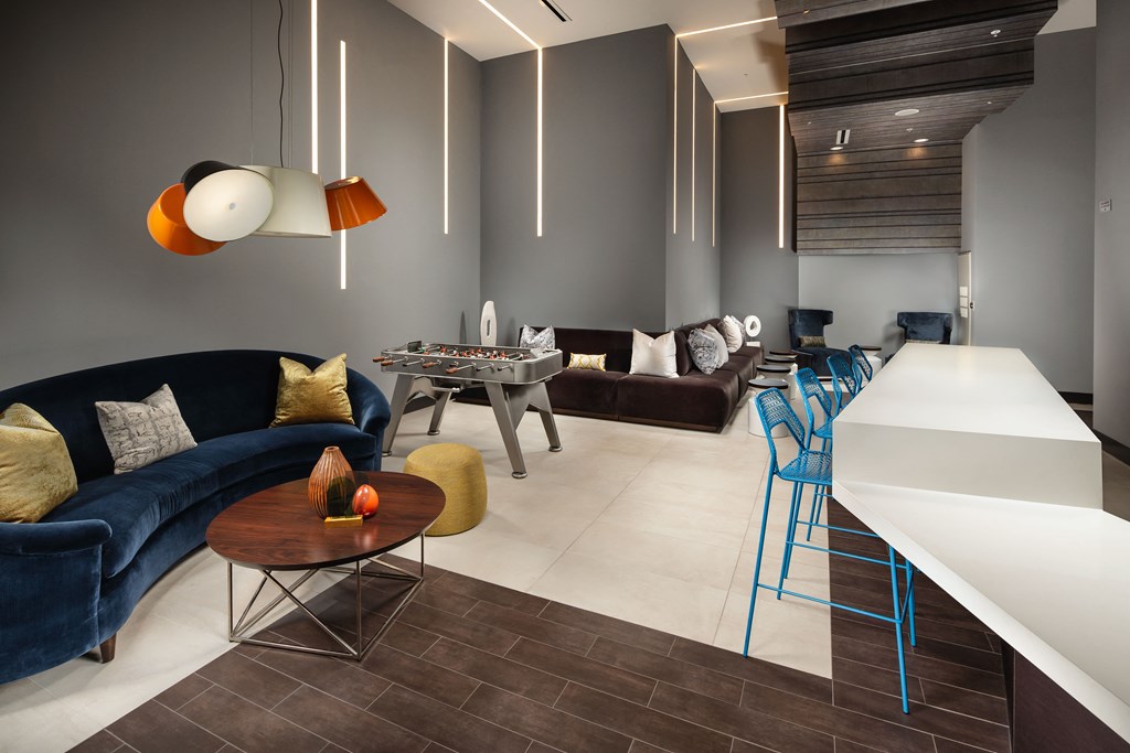 a living room with couches and chairs and a table