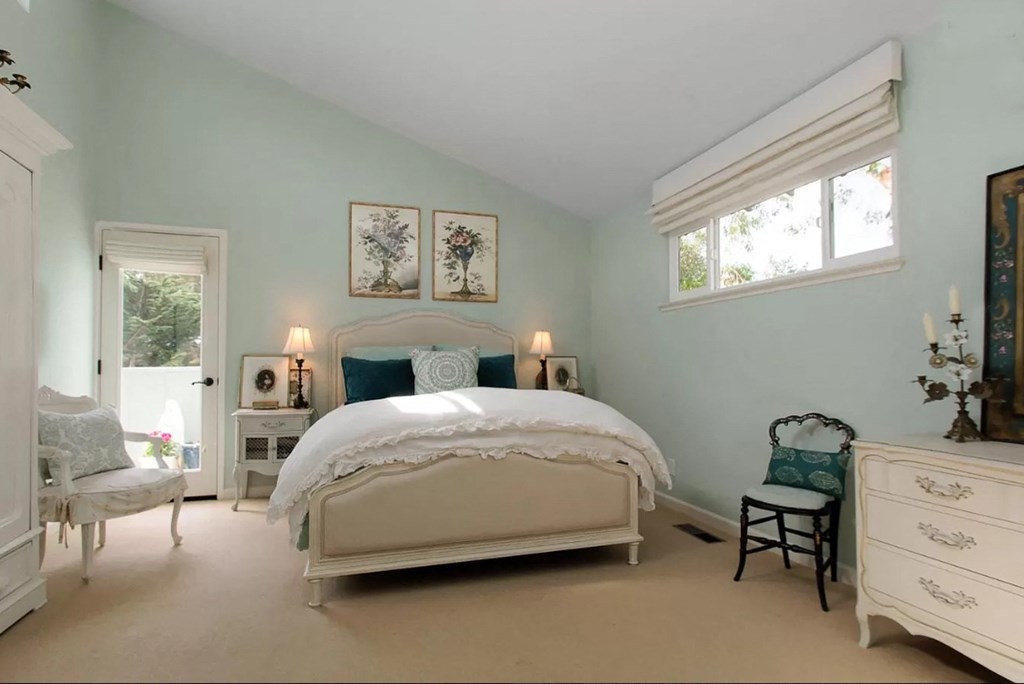 bedroom with bed and blue pillows