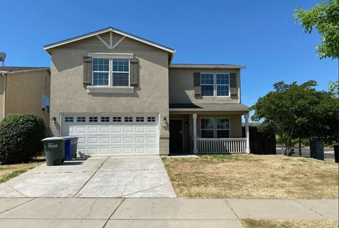 a house with a driveway and a garage door