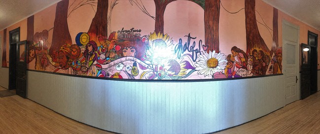 a large mural on the wall of a room
