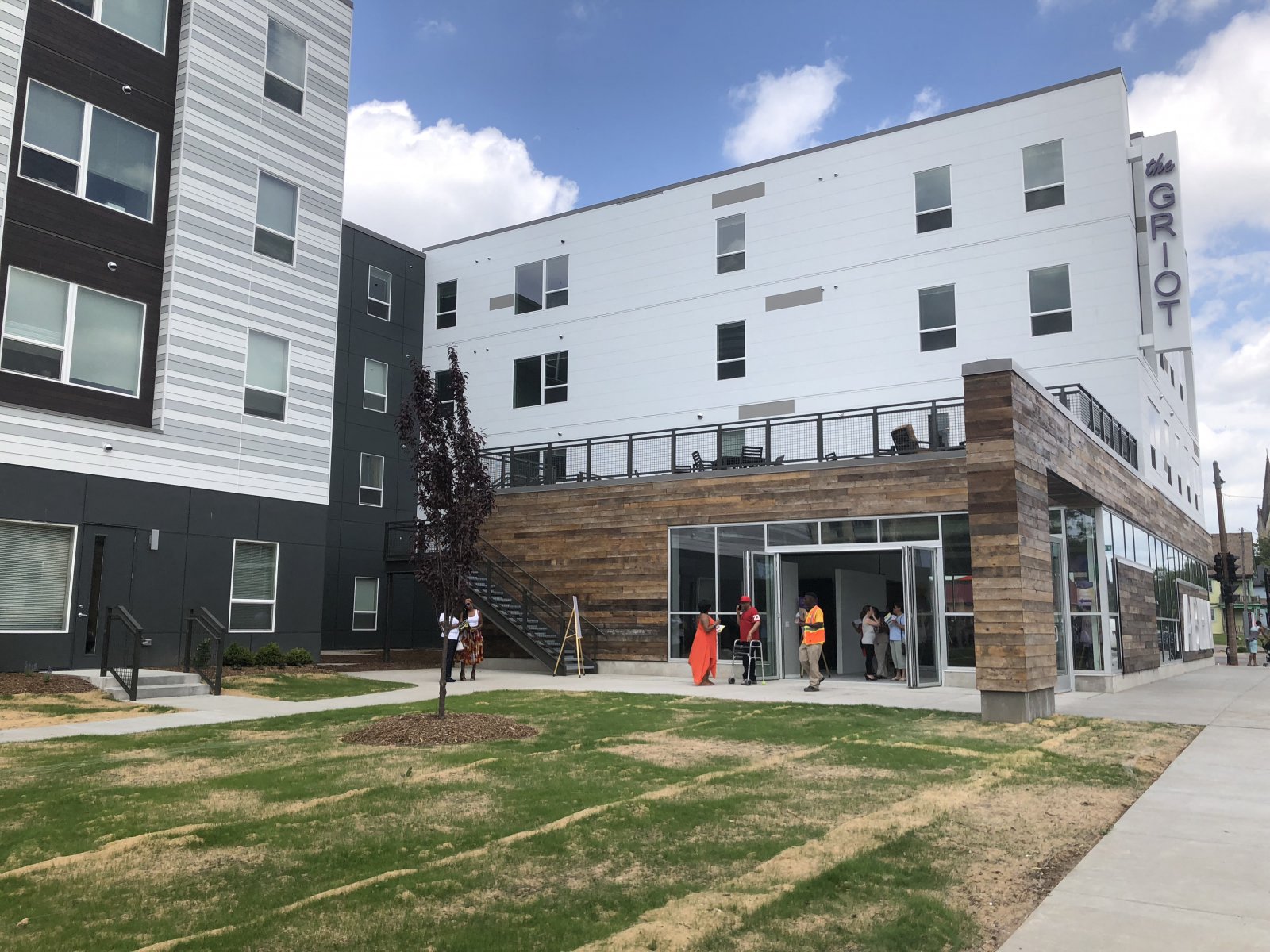 a group of people standing outside of a building