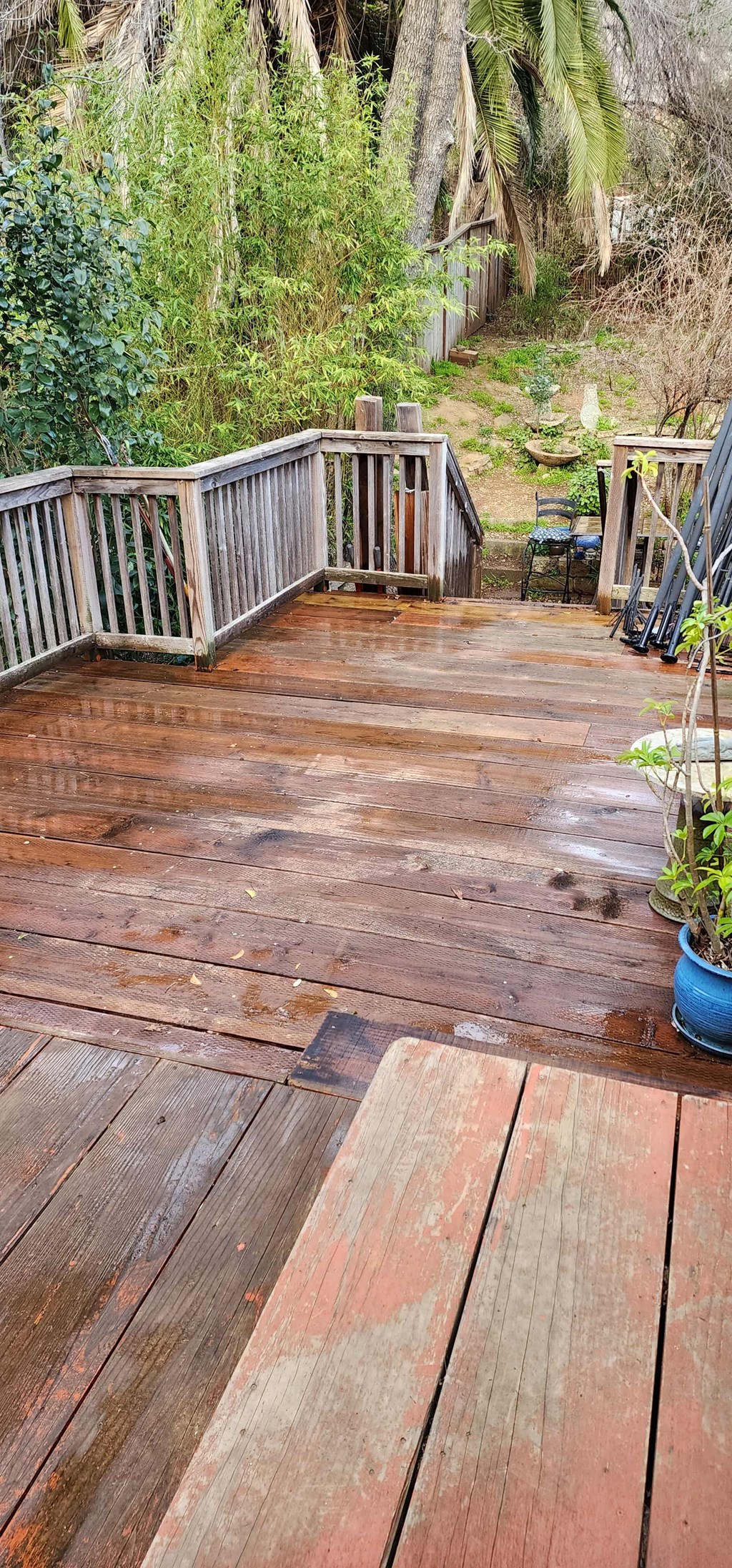 a wooden deck with a bench on top of it