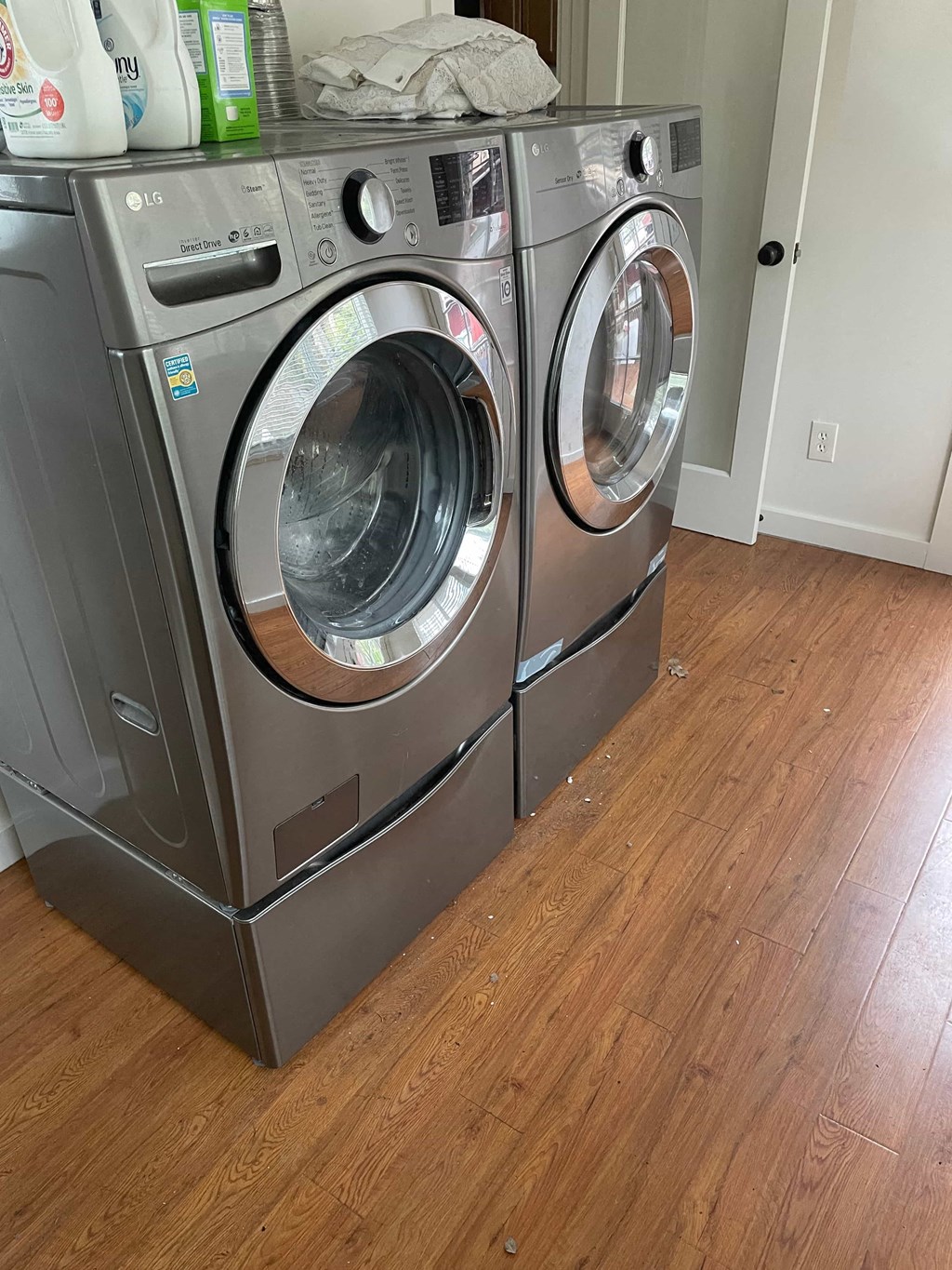 a front loading washer and dryer in a laundry room