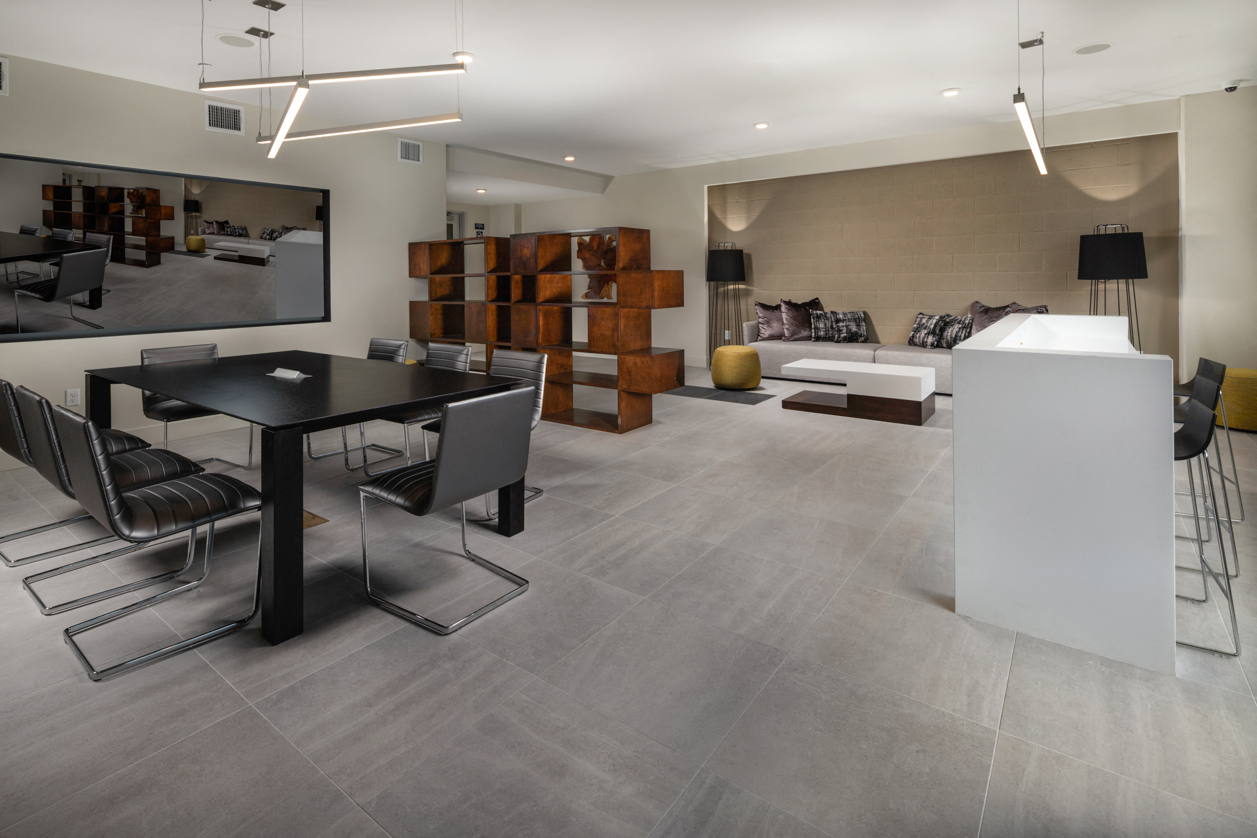 a dining room and living room with a table and chairs