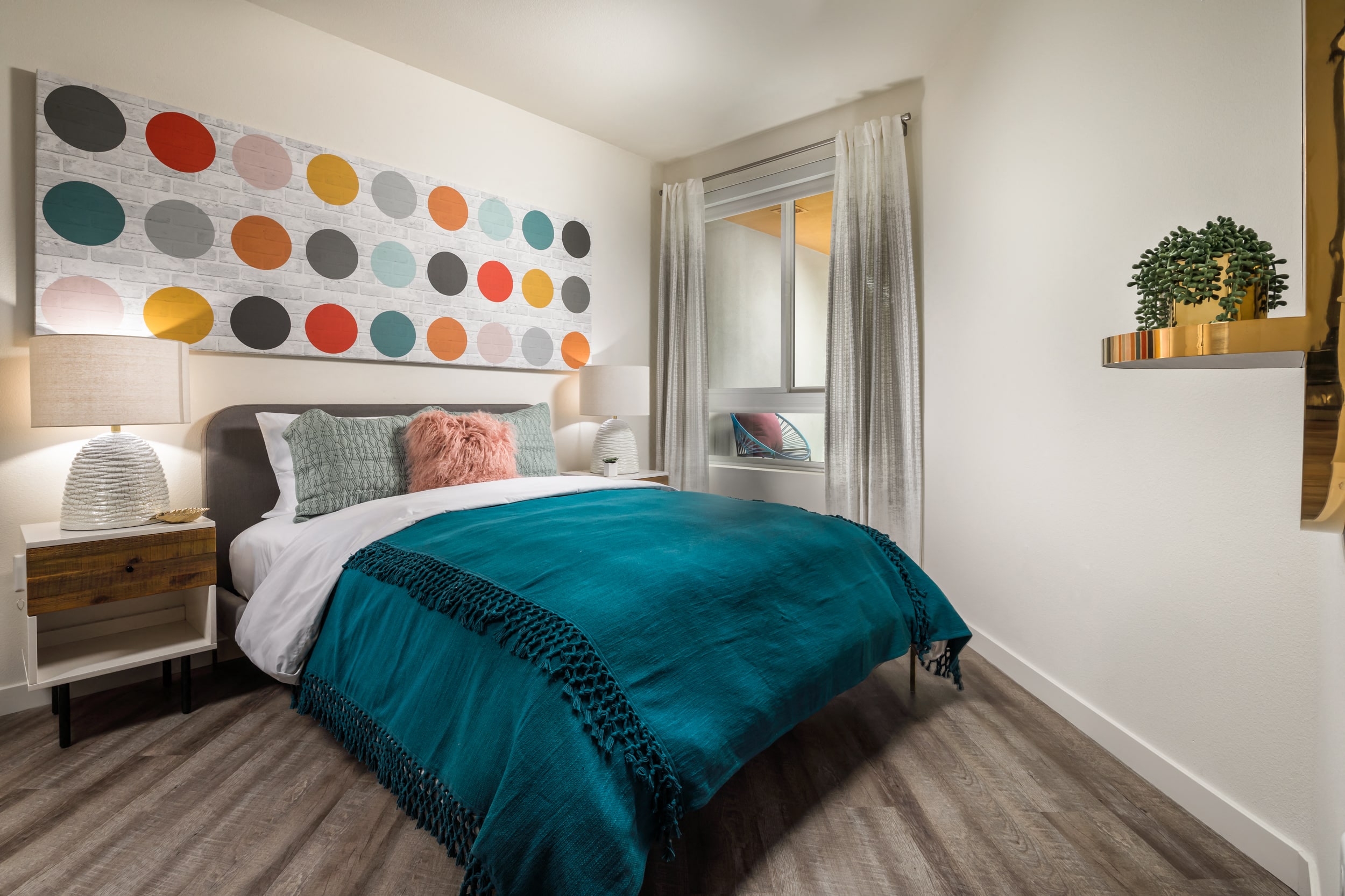 Bedroom with wall decor and large window