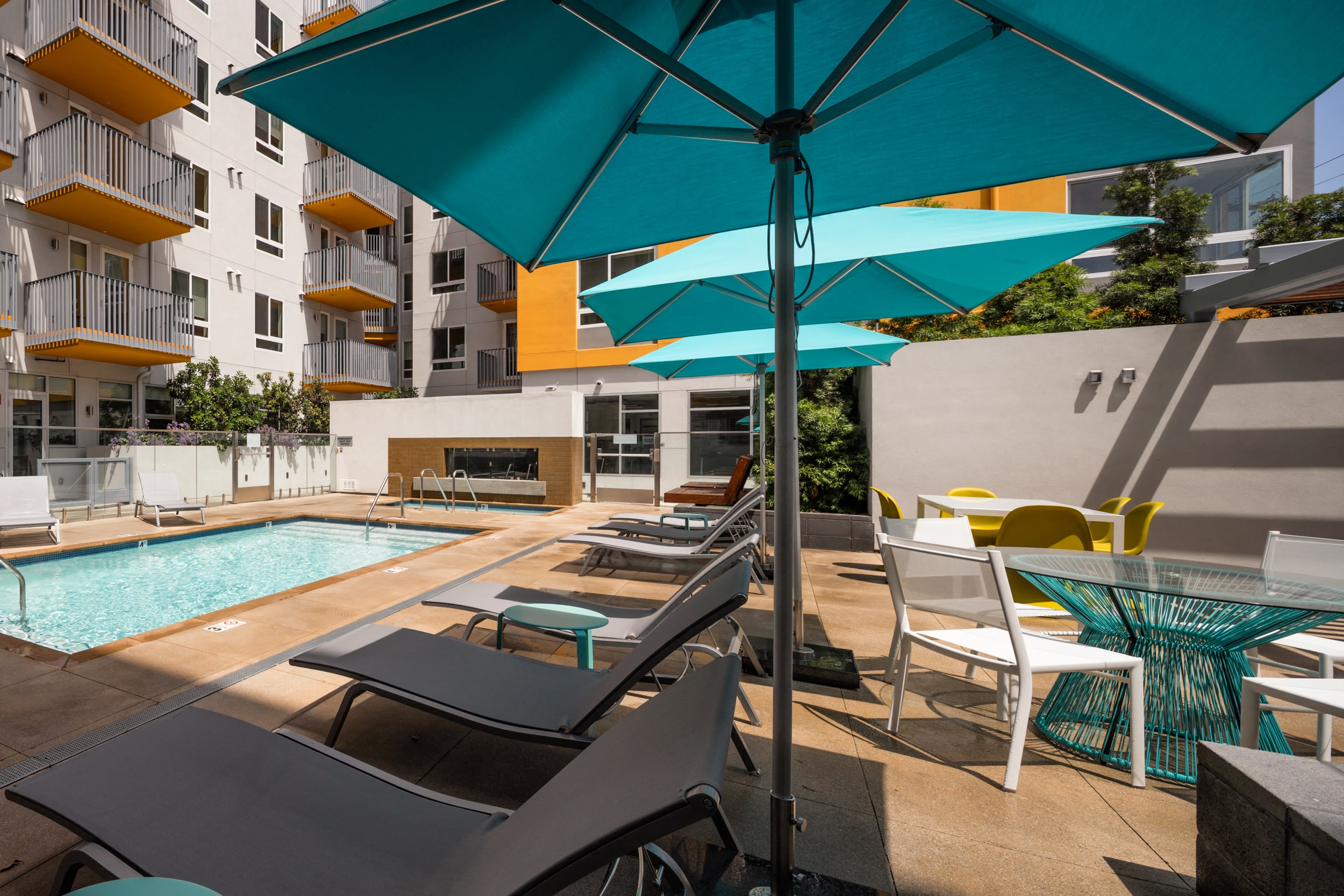 Lounge seating with umbrellas by pool