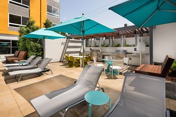 lounge chairs with umbrellas