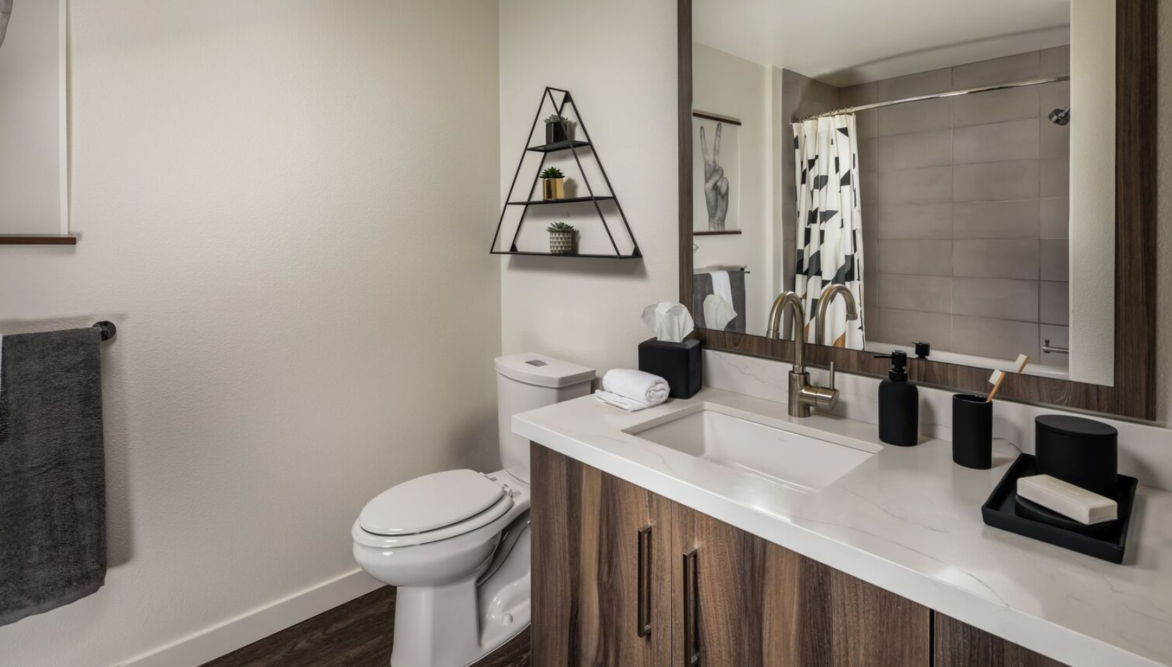 bath with white counter and sink and a toilet