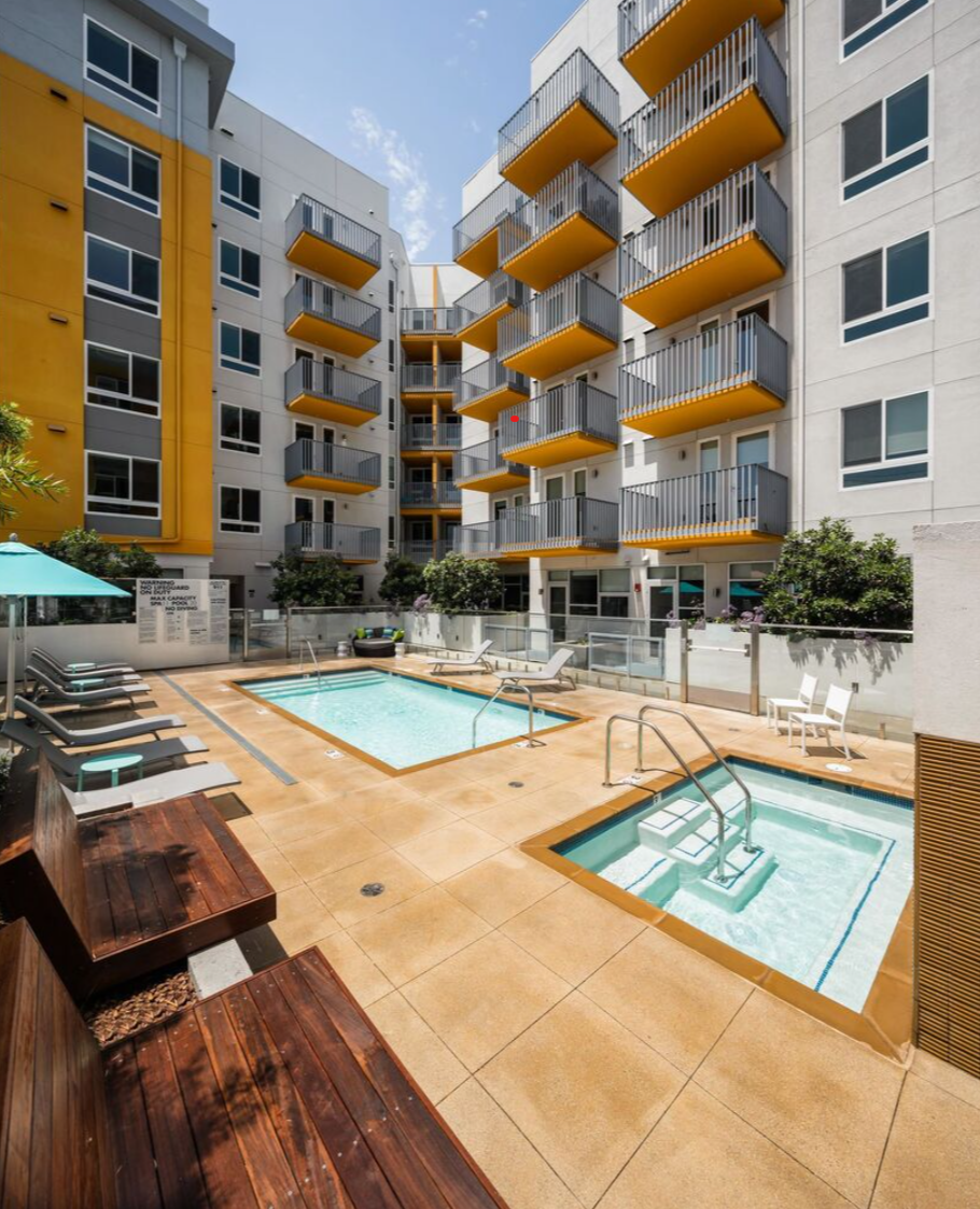 Pool and hot tub with lounge seating