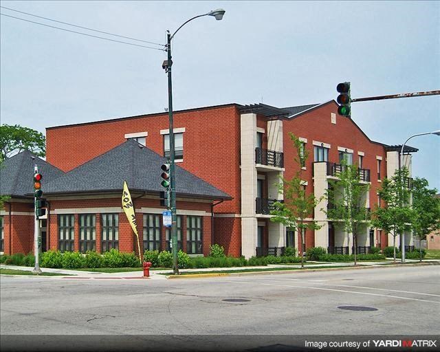 a red brick building on the corner of a street