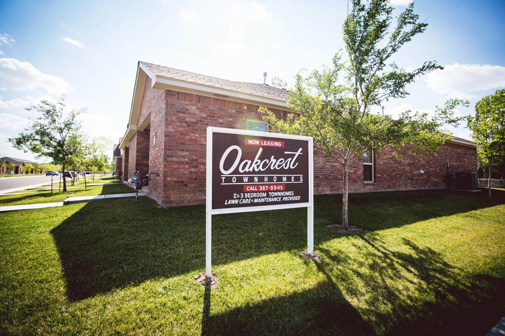 a sign in front of an office building