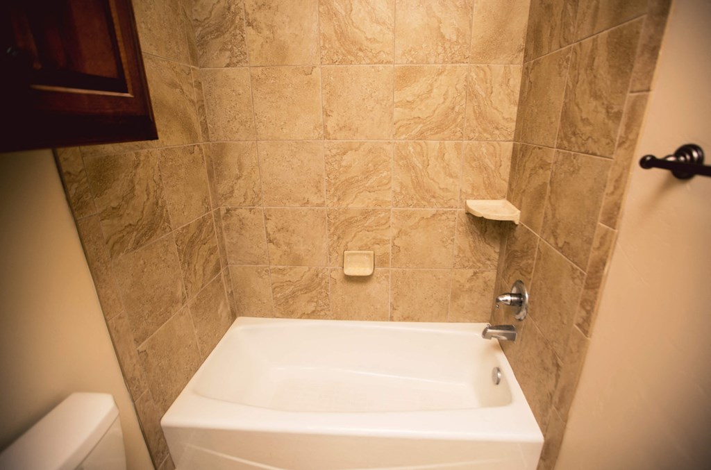 a small bathroom with a shower and a sink