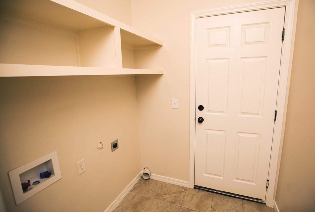a room with a closet and a white door