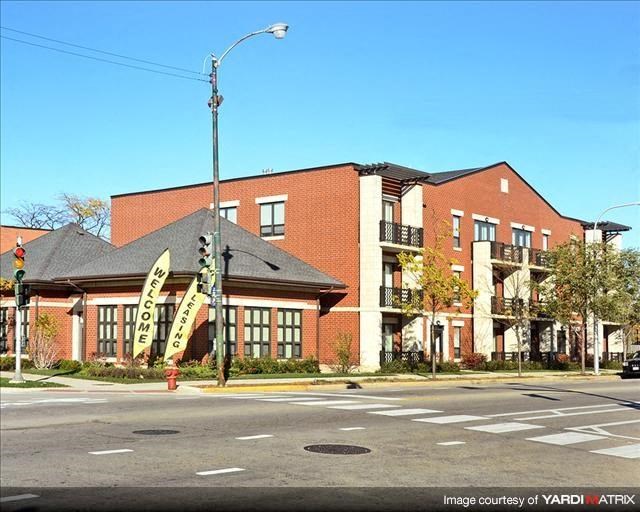 a large brick building on the corner of a street