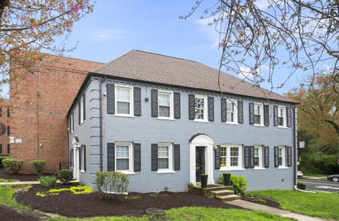 a blue house with a brick