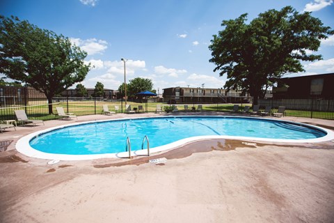 a swimming pool with a fence around it
