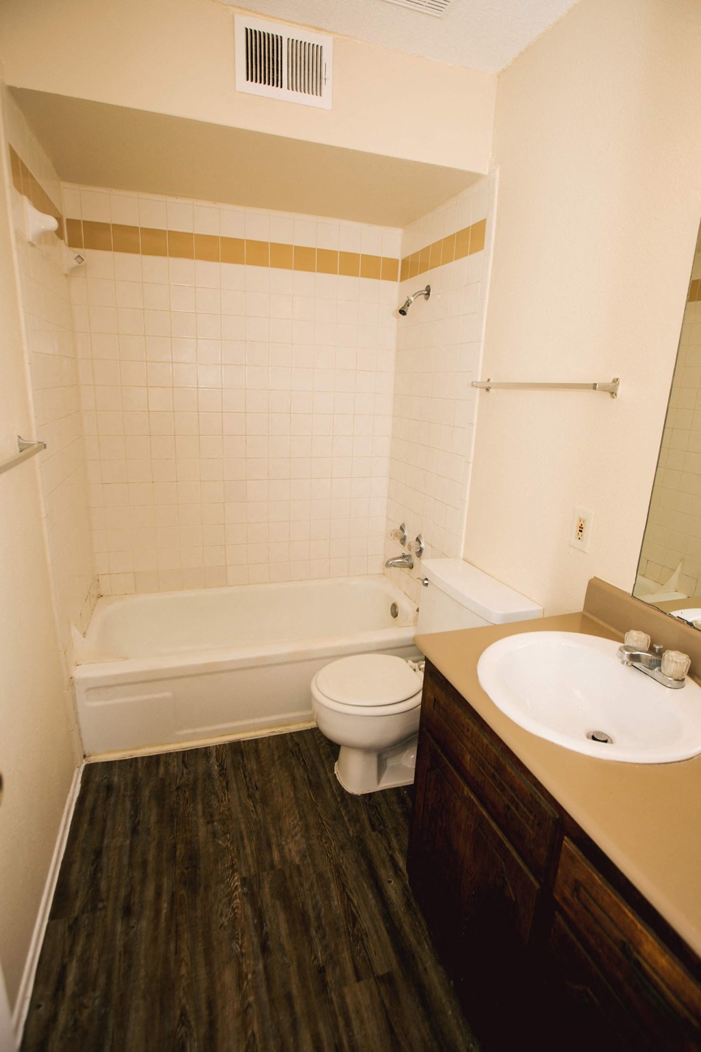 a small bathroom with a sink toilet and bath tub