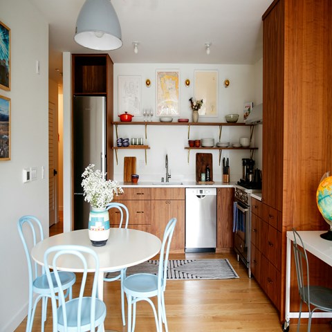 a kitchen and dining room with a table and chairs