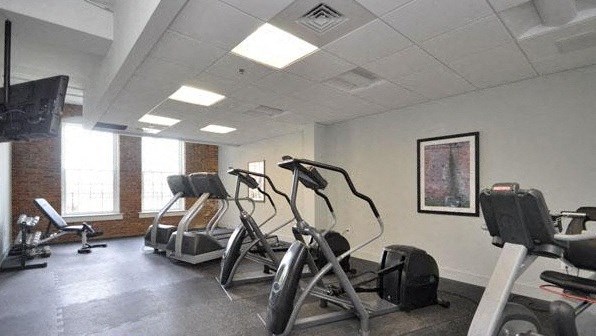 a gym with various exercise equipment in a room