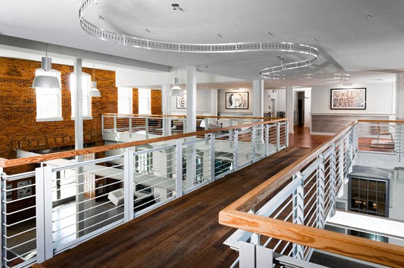 the interior of a building with a lobby and a staircase