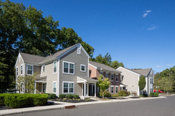 a row of houses on the side of a street