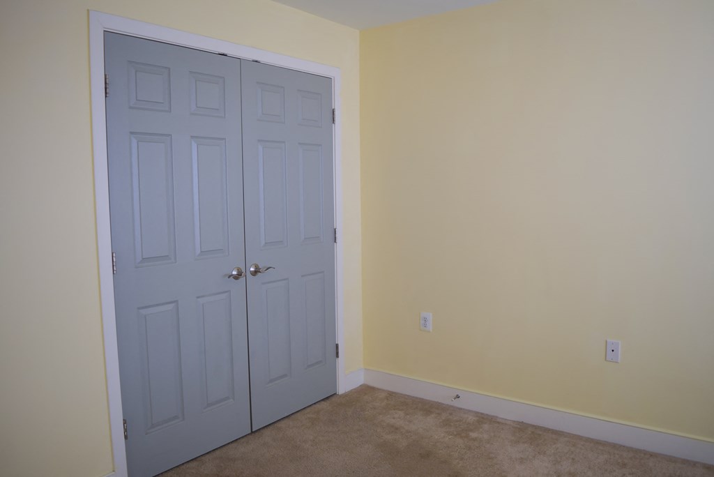 the door is closed and the room is empty