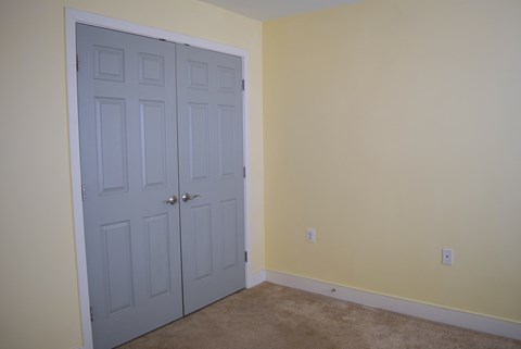 the door is closed and the room is empty