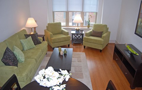a living room with a couch and chairs