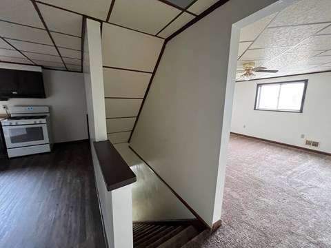 a view of a living room from the stairs