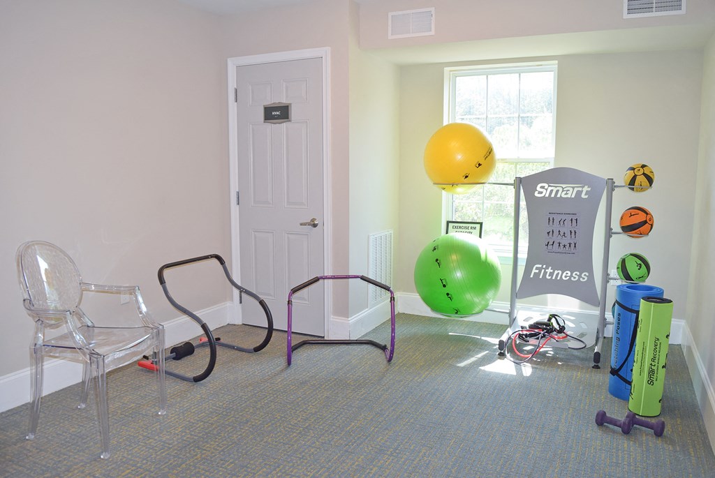 a room with chairs and balloons and a door