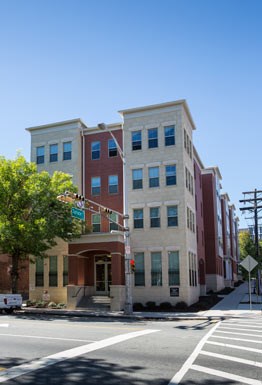 a building on a street corner with a traffic light