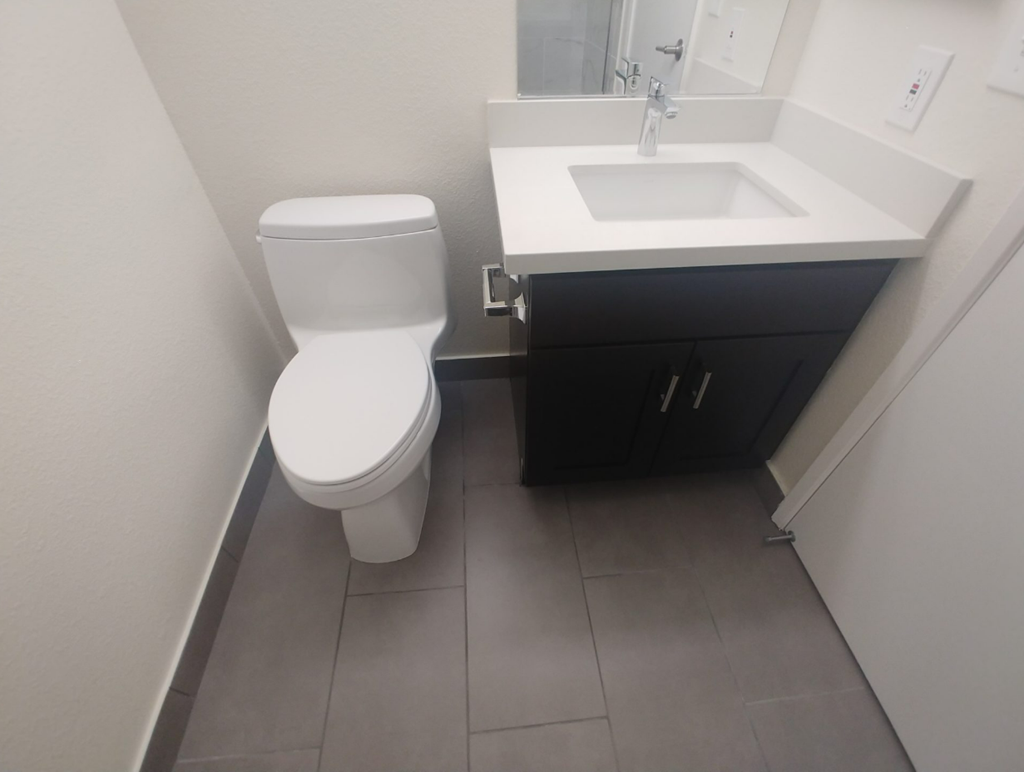 a bathroom with a toilet and a sink