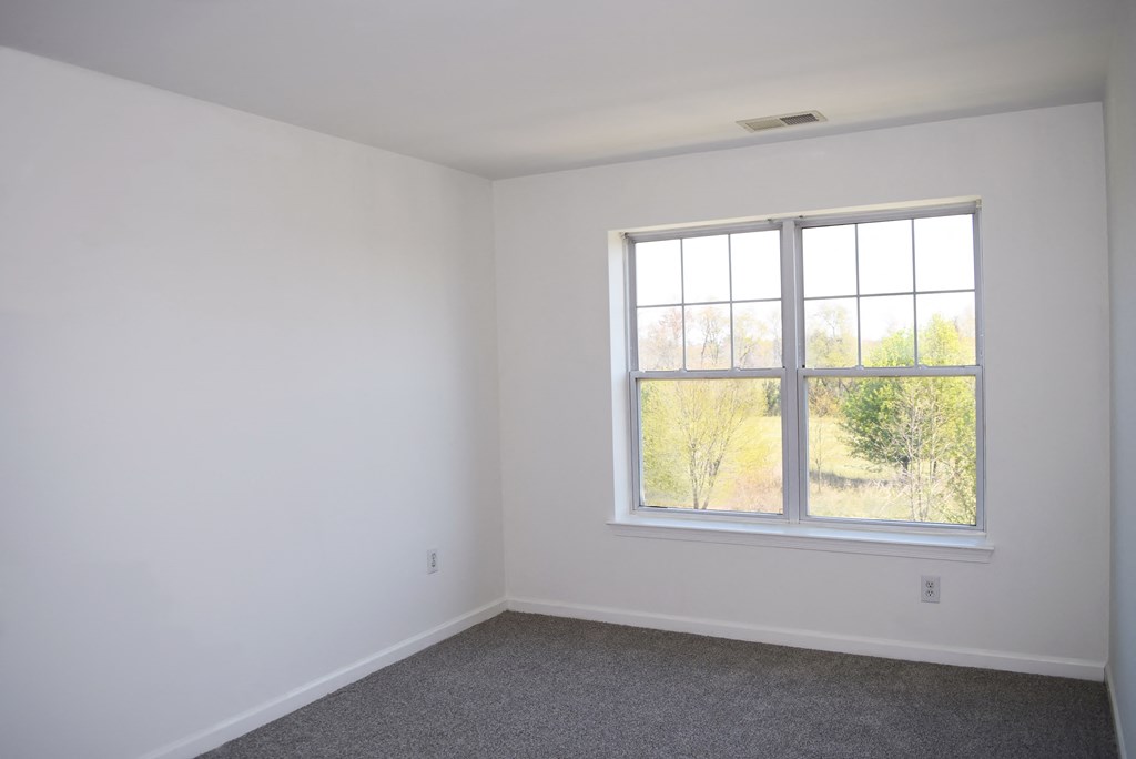 an empty room with a window in it