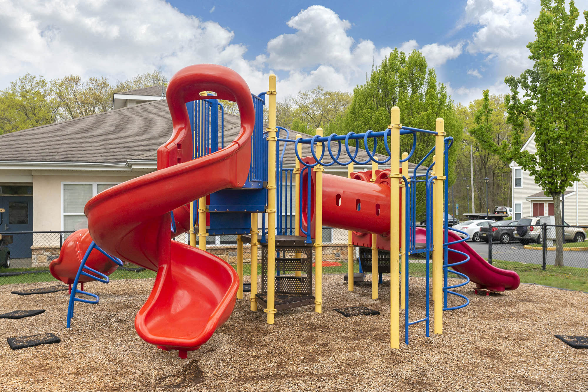 a playground with slides at a park