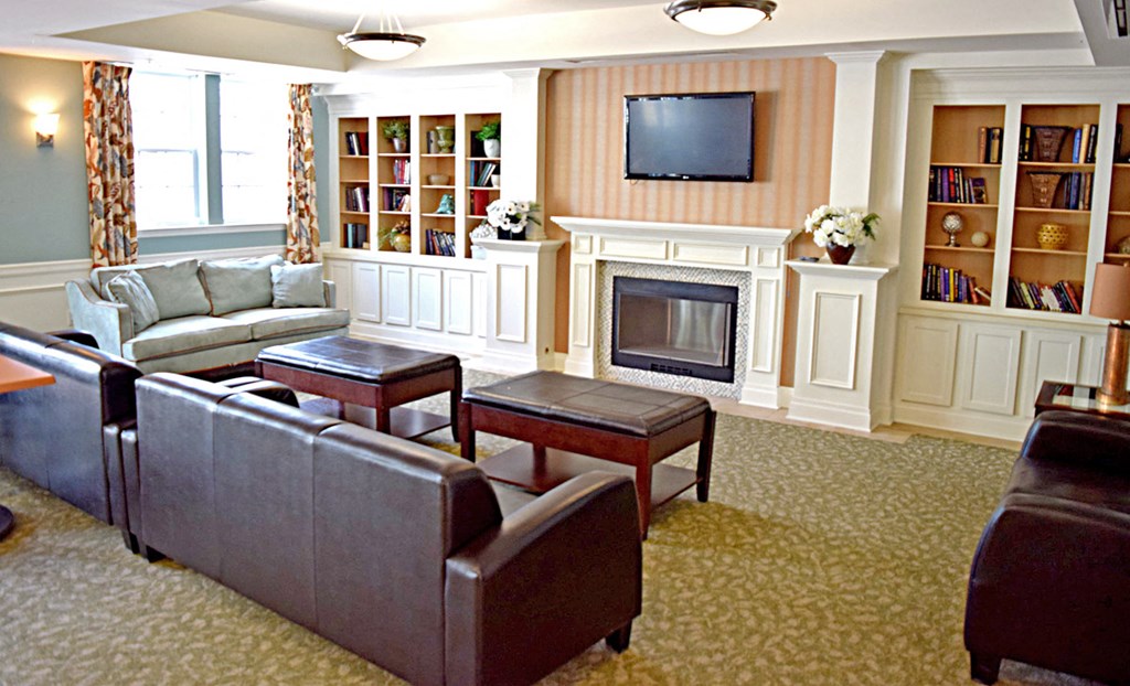 a living room filled with furniture and a fireplace