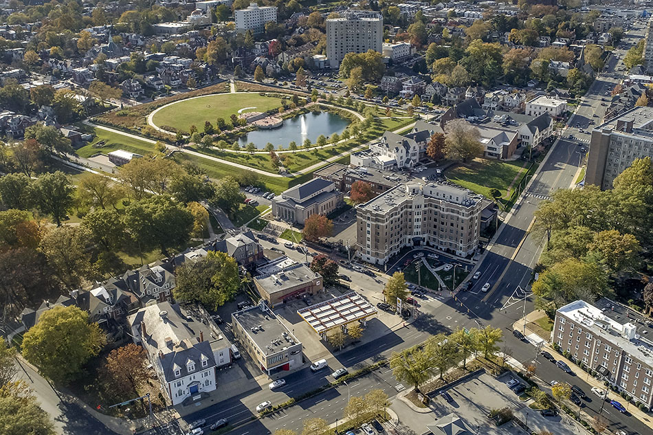 an aerial view of a city with a park and buildings